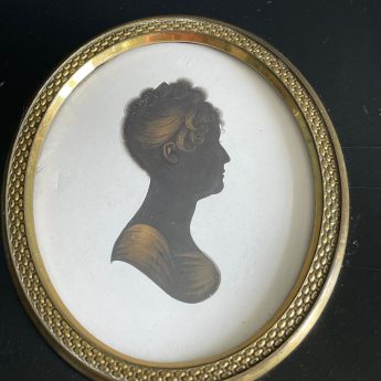 John Field, painted and gilded silhouette on plaster of a young lady