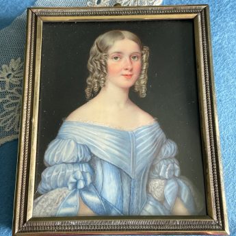 A pair of portrait miniatures of sisters in blue dresses
